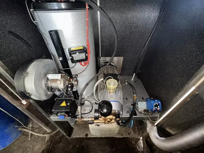 Nilfisk SH Truck Booster pressure washer reinstalled on site after full service and pump overhaul, running smoothly and ready for use.